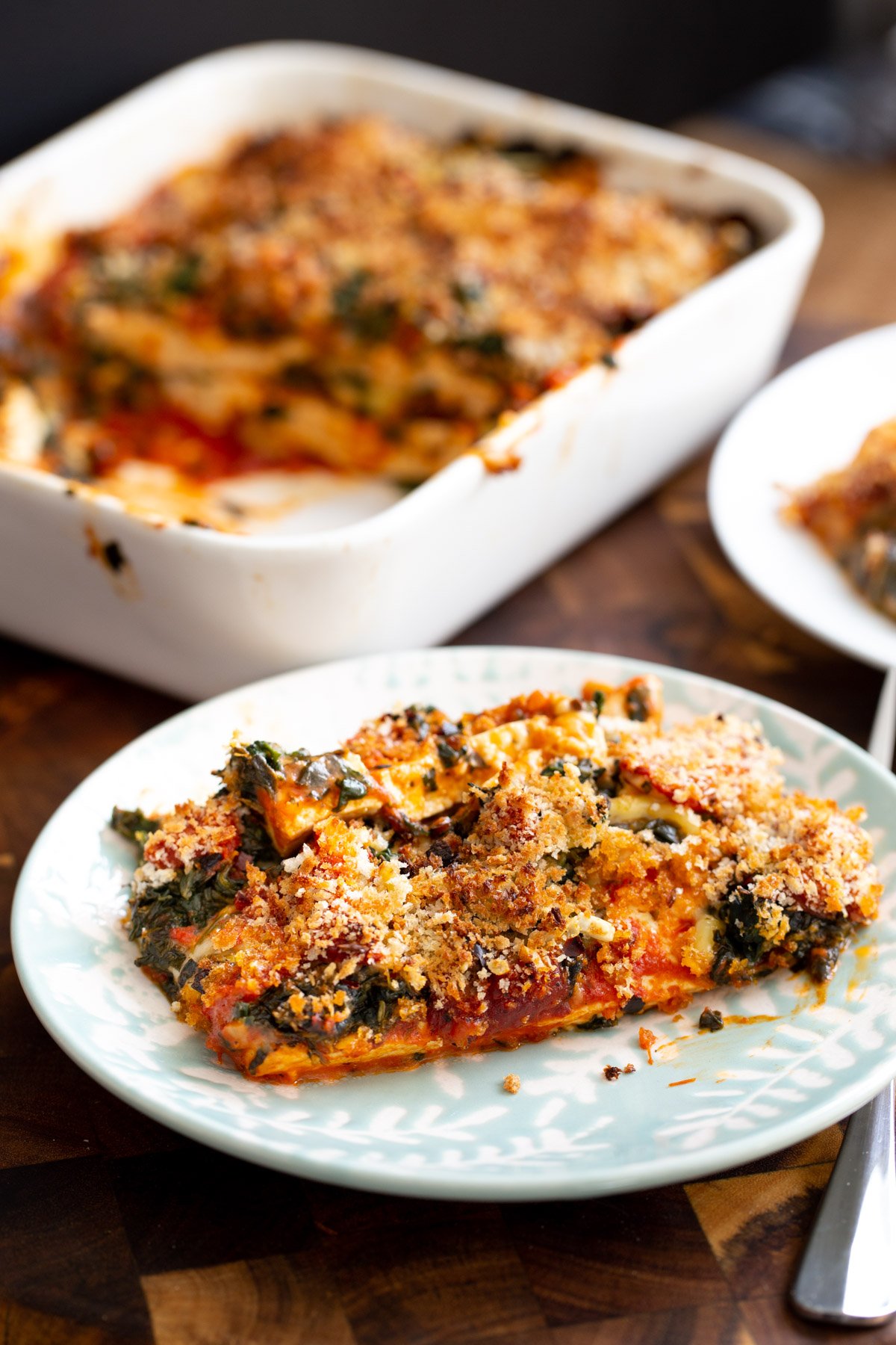 a serving of tofu bake with spinach, cheese and marinara sauce