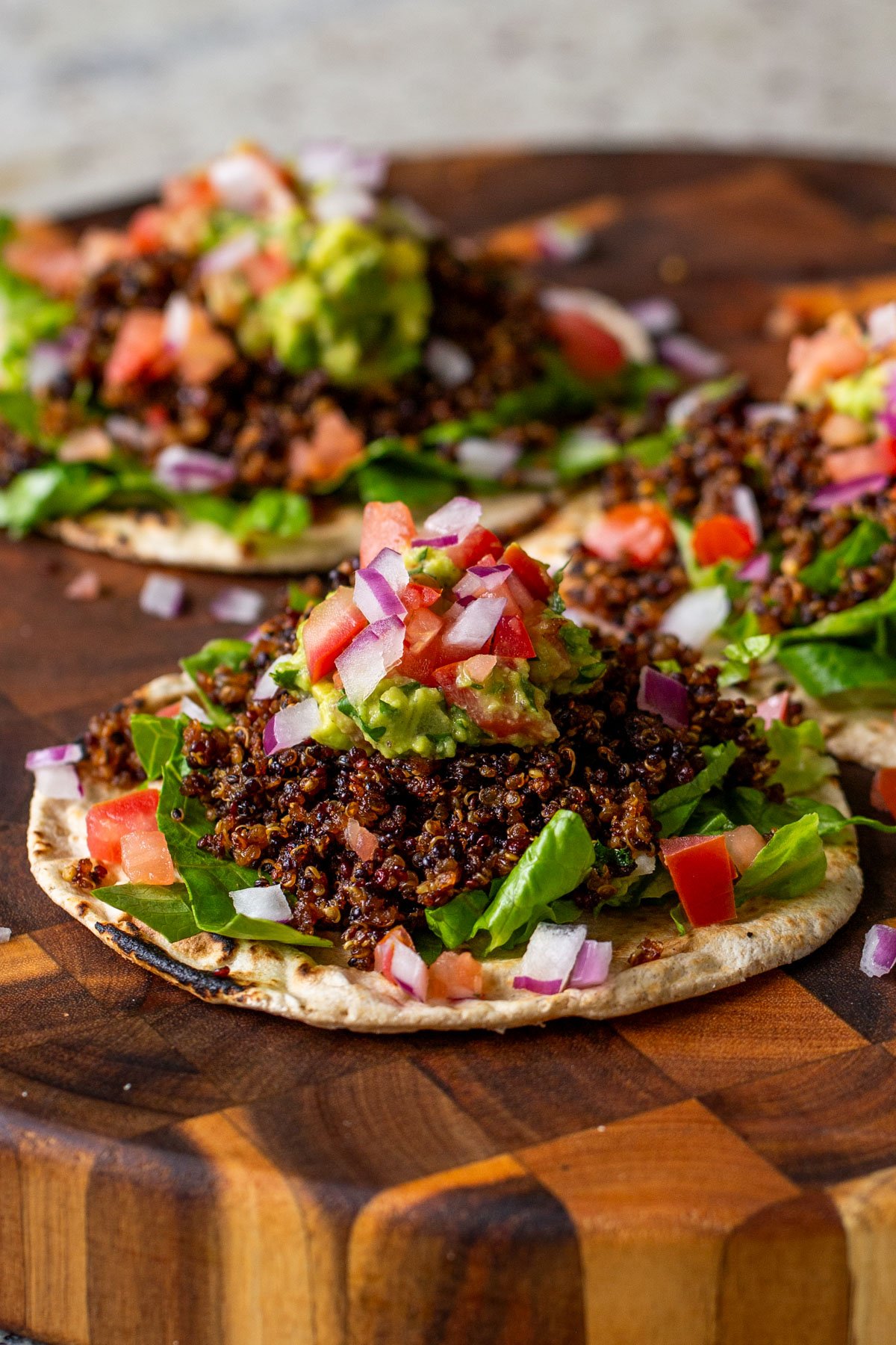 3 crispy quinoa tacos on a serving tray